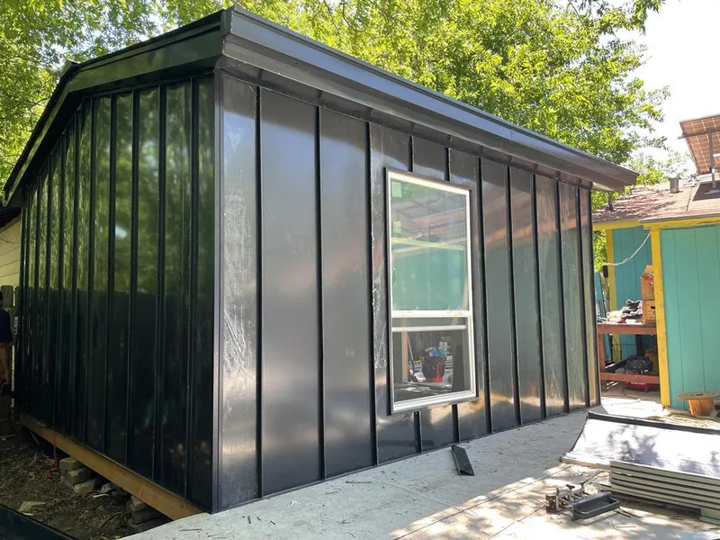 Black standing seam metal wall panels for Roof Inspection in Madisonville